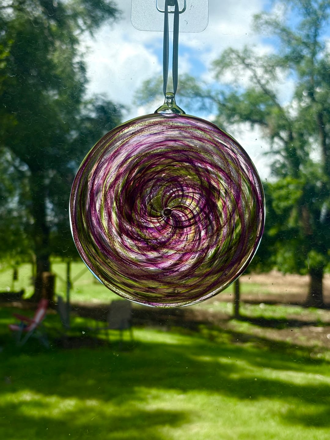Customer photo review of Glass Disc Suncatcher with Cremation Ash