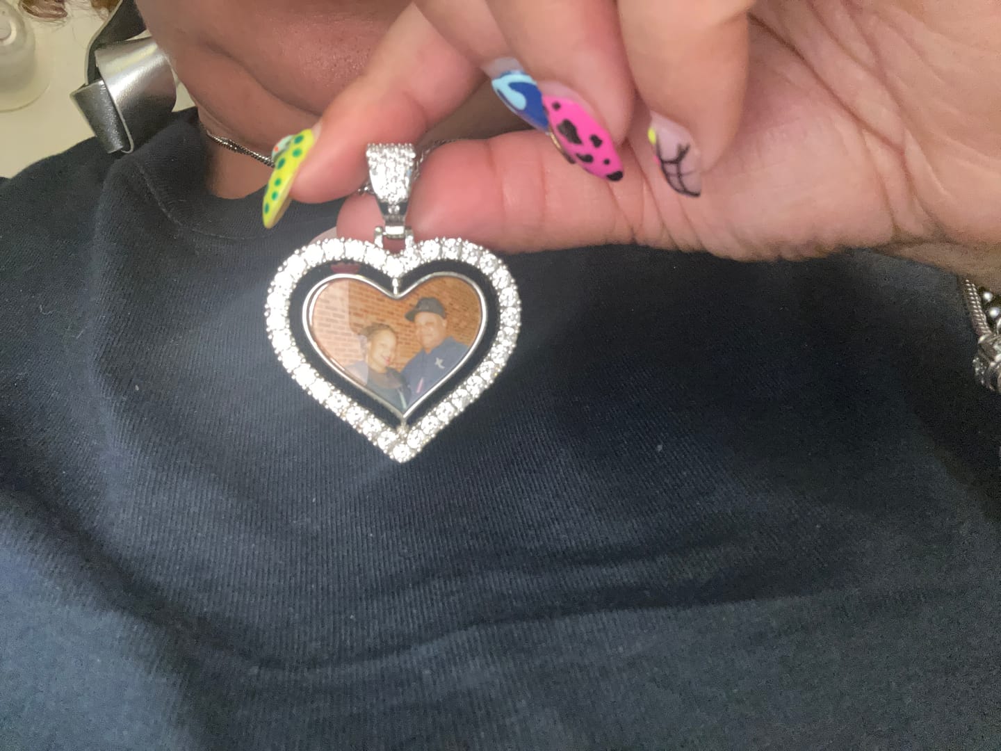 Customer photo review of Iced Heart Spinning Photo Pendant