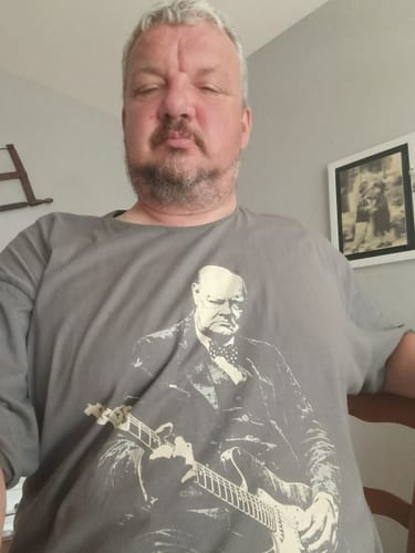 Reviewer wearing the grey Churchill Rock T-Shirt with its graphic of Winston Churchill playing a guitar.
