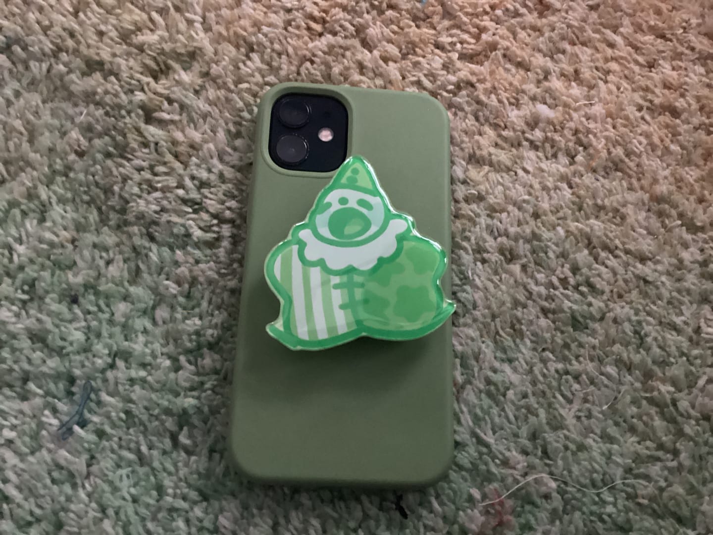 Customer photo review of Lil Green Clown Phone Grip