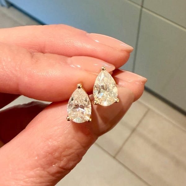Customer photo review of Classica Pear Cut Moissanite Solitaire Stud Earrings