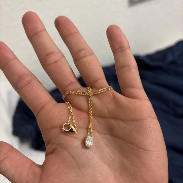 Customer photo review of Classica VVS1 Oval Cut Moissanite Solitaire Necklace