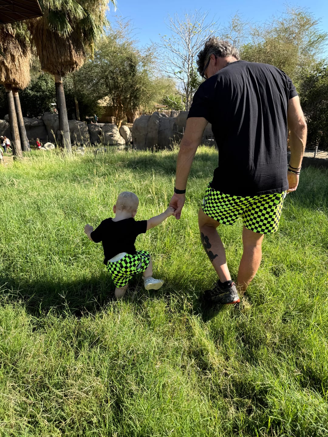 Customer photo review of Hybrid Swim Trunks in Neon Electric Lime + Black Checkered