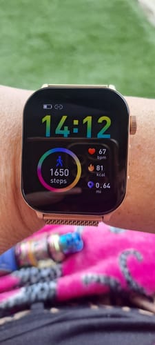 Customer's Gard Pro Health 4 Smartwatch on their wrist, with the active screen showing steps, heart rate, and calories.