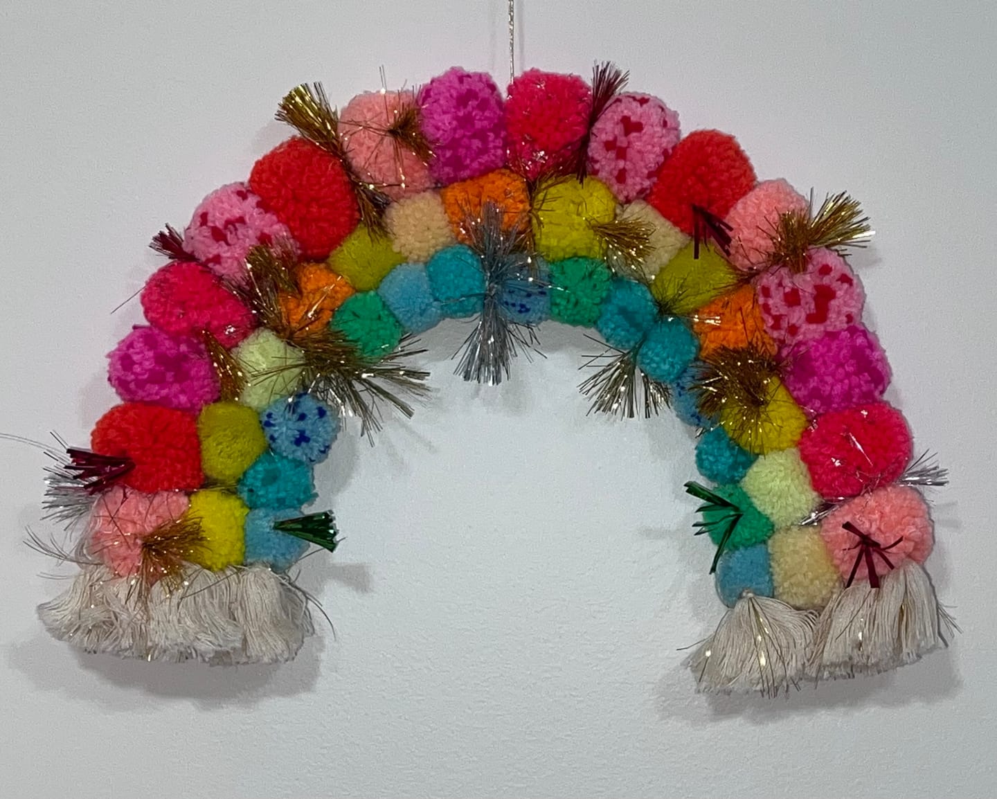 Customer photo review of Pom pom Rainbow wall hanging
