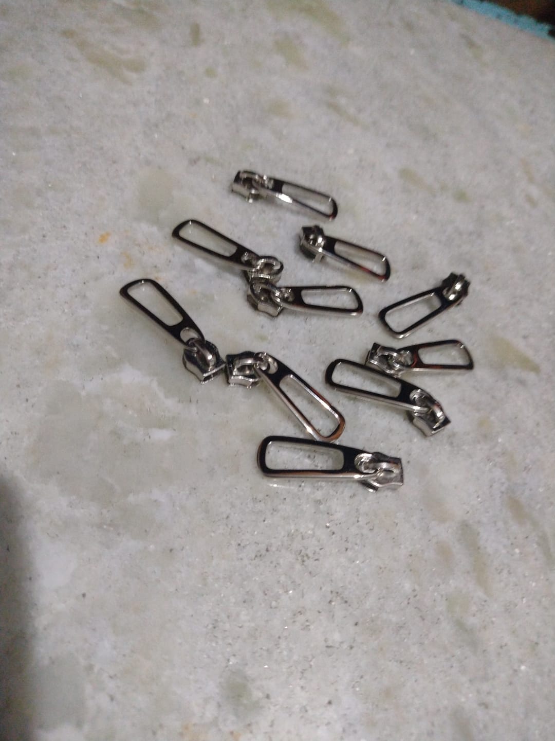 Customer photo review of PUXADOR VAZADO N°6 C/CARRINHO NIQUELADO 10 PEÇAS