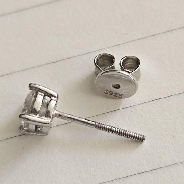Customer photo review of Classica VVS1 Round Moissanite Solitaire Stud Earrings
