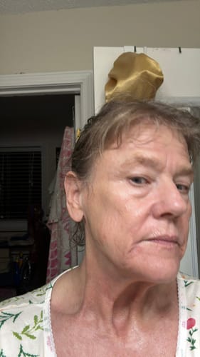 Close-up of a reviewer's face and neck showing the results after using the Deep Collagen Cream.