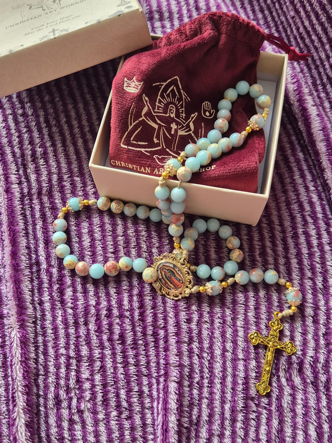 Customer photo review of Christianartworkshop Aqua Stone Prayer Rosary with Gold Accents: A Divine Source of Peace and Devotion