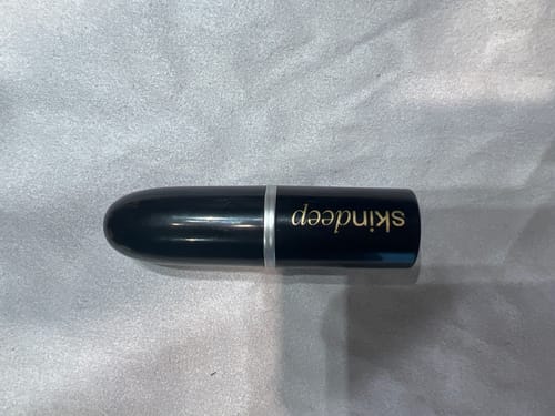 Customer's black lipstick-style DO OR DYE Pro Root Touch-up Hair Stick.