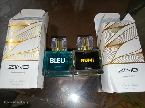 Customer's blue Bleu De Zing perfume bottle and another fragrance shown side-by-side with their original boxes.