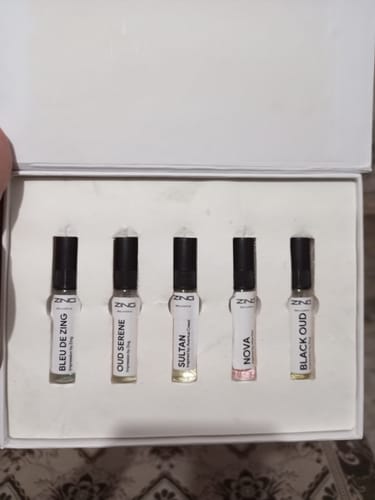 Customer's open Summer Tester Pack showing five small perfume vials arranged inside the white presentation box.