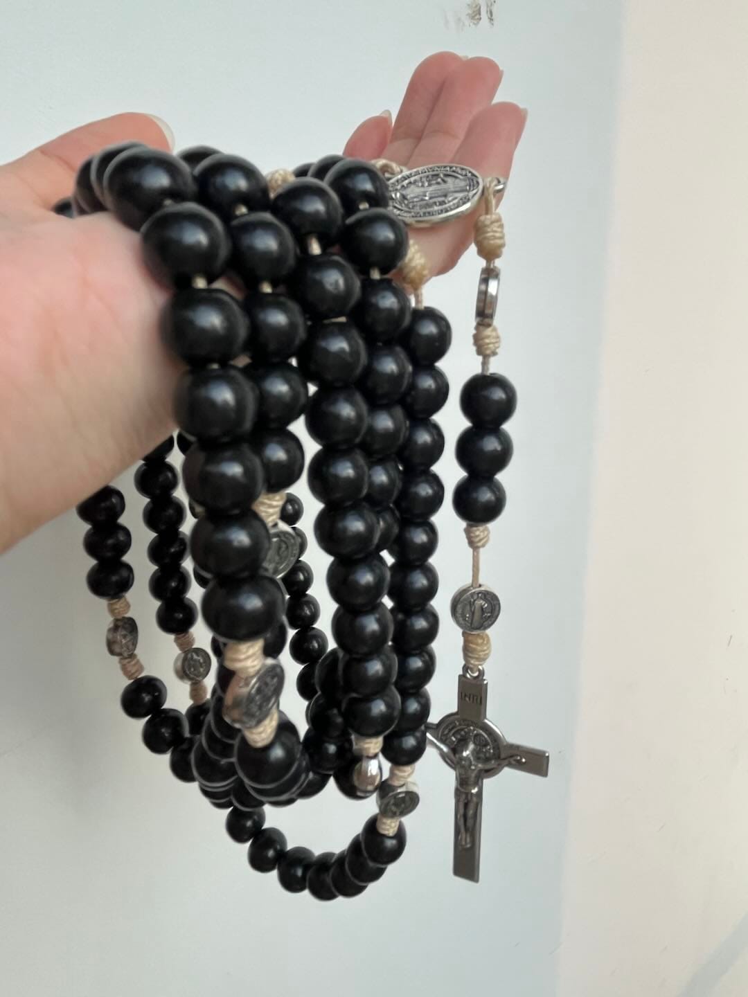 Customer photo review of SolaceBeads 15 Decade Ebony Wood Rosary With St. Benedict Medals & Crucifix: Protective Strength