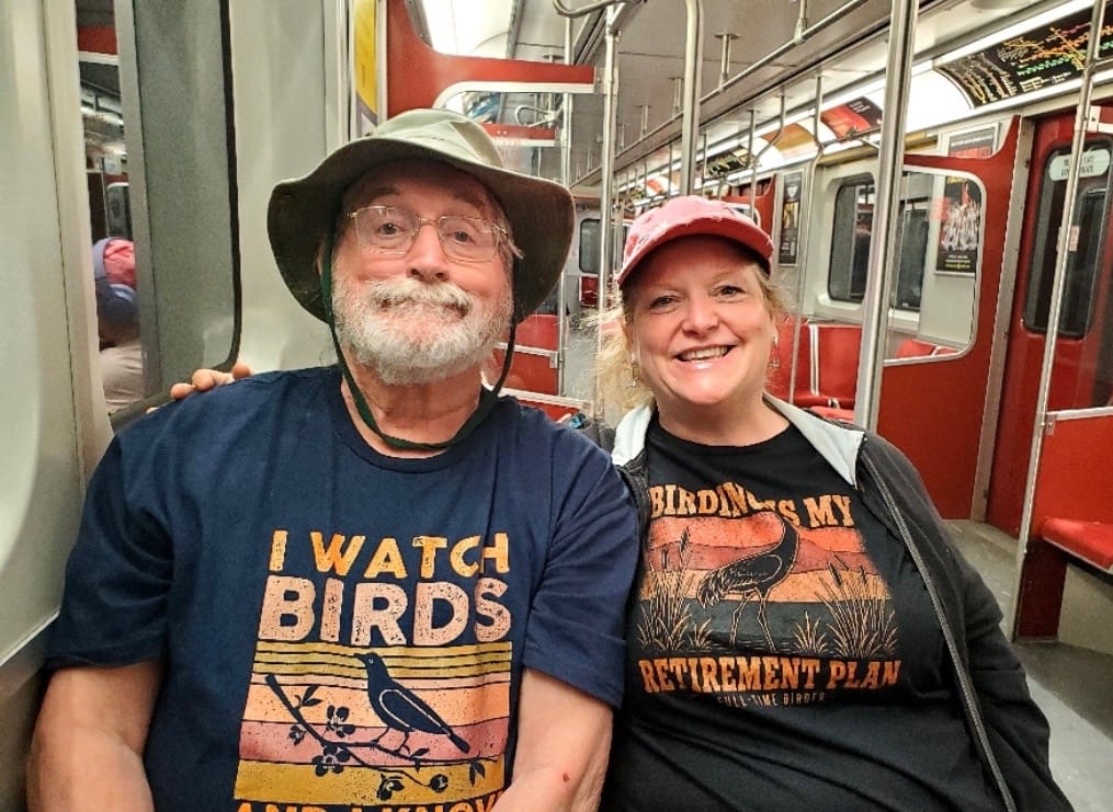 Laurie H. wearing the Watch Birds, Know Things T-Shirt
