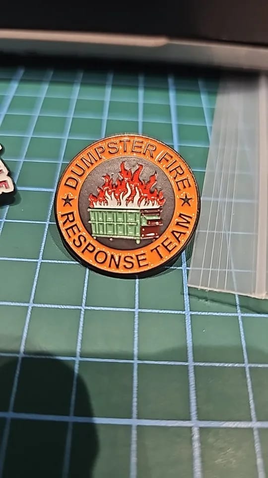 Customer photo review of Dumpster Fire Pin