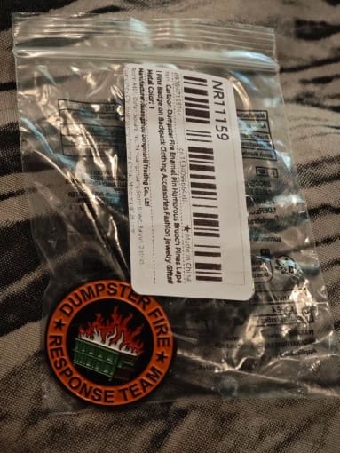 Customer photo review of Dumpster Fire Pin