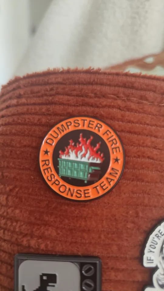 Customer photo review of Dumpster Fire Pin