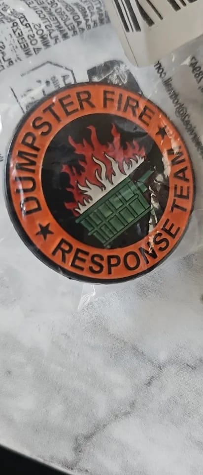 Customer photo review of Dumpster Fire Pin