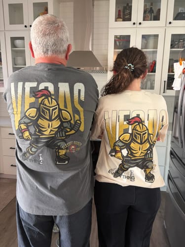 Two customers showing the fit of the Vegas Playoff Hockey T-Shirt from behind, in grey and cream.