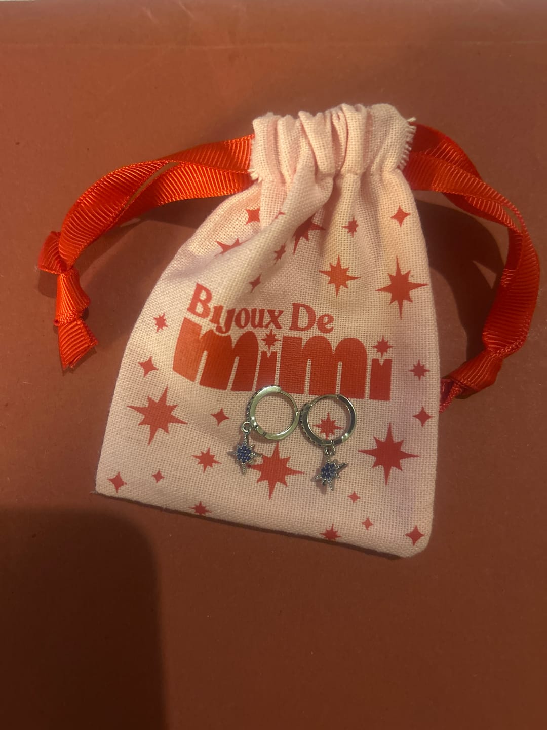 Customer photo review of Cosima Crystal Gold Star Huggie Earrings