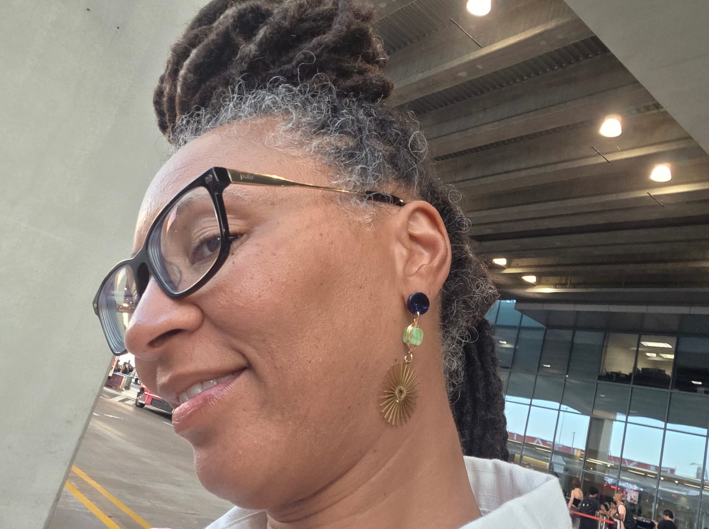 Customer photo review of Isela Deep Blue + Green Jade Sun Burst Earrings
