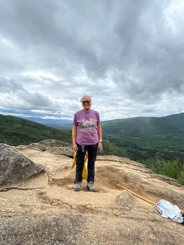 Reviewer wearing the purple Fox Spirit T-Shirt while on a mountain hike in Alaska.