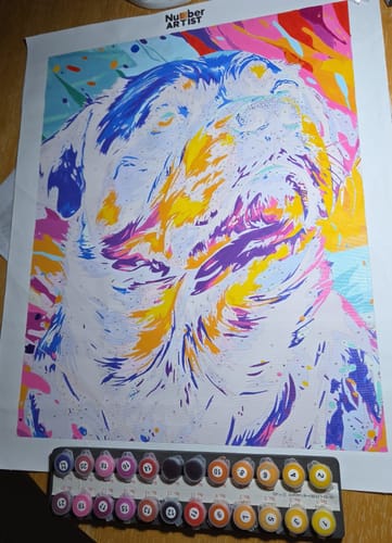 Customer's colorful paint-by-numbers canvas of a dog, partially completed.