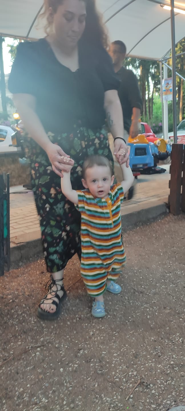 Customer photo review of Rainbow Striped Towelling Romper