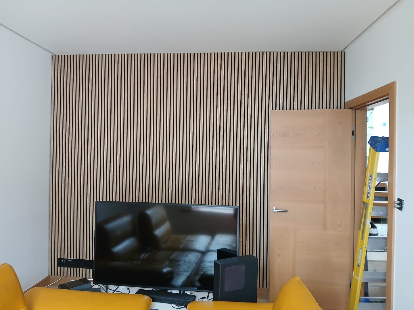 Customer photo review of SlatWall Acoustic Honey Oak and Black Slatted Wall Panel