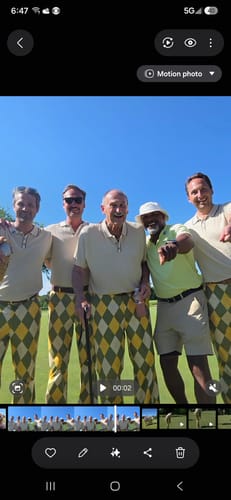 Customers in matching Yollow Argyle Stretch Golf Pants posing on a golf course.