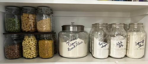 Reviewer's organized pantry showing various mason jars of dry goods sealed to stay fresh.