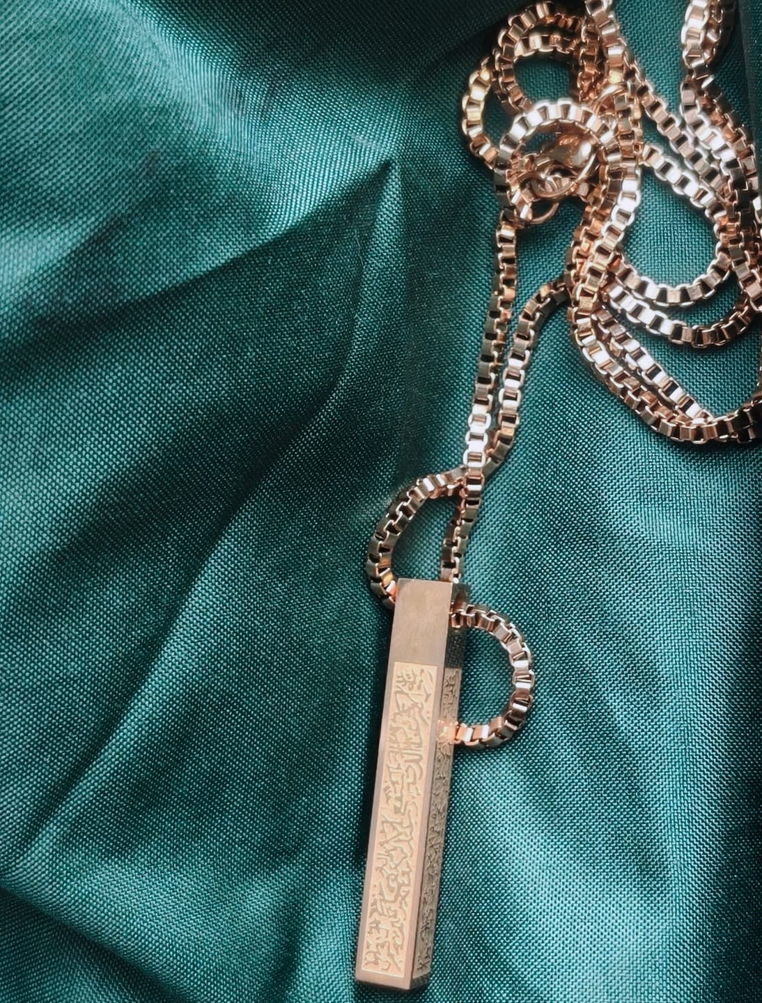 Customer photo review of HilalHaven Pillar of Protection Ayatul Kursi 4-Sided Bar Necklace — Polished Titanium Steel