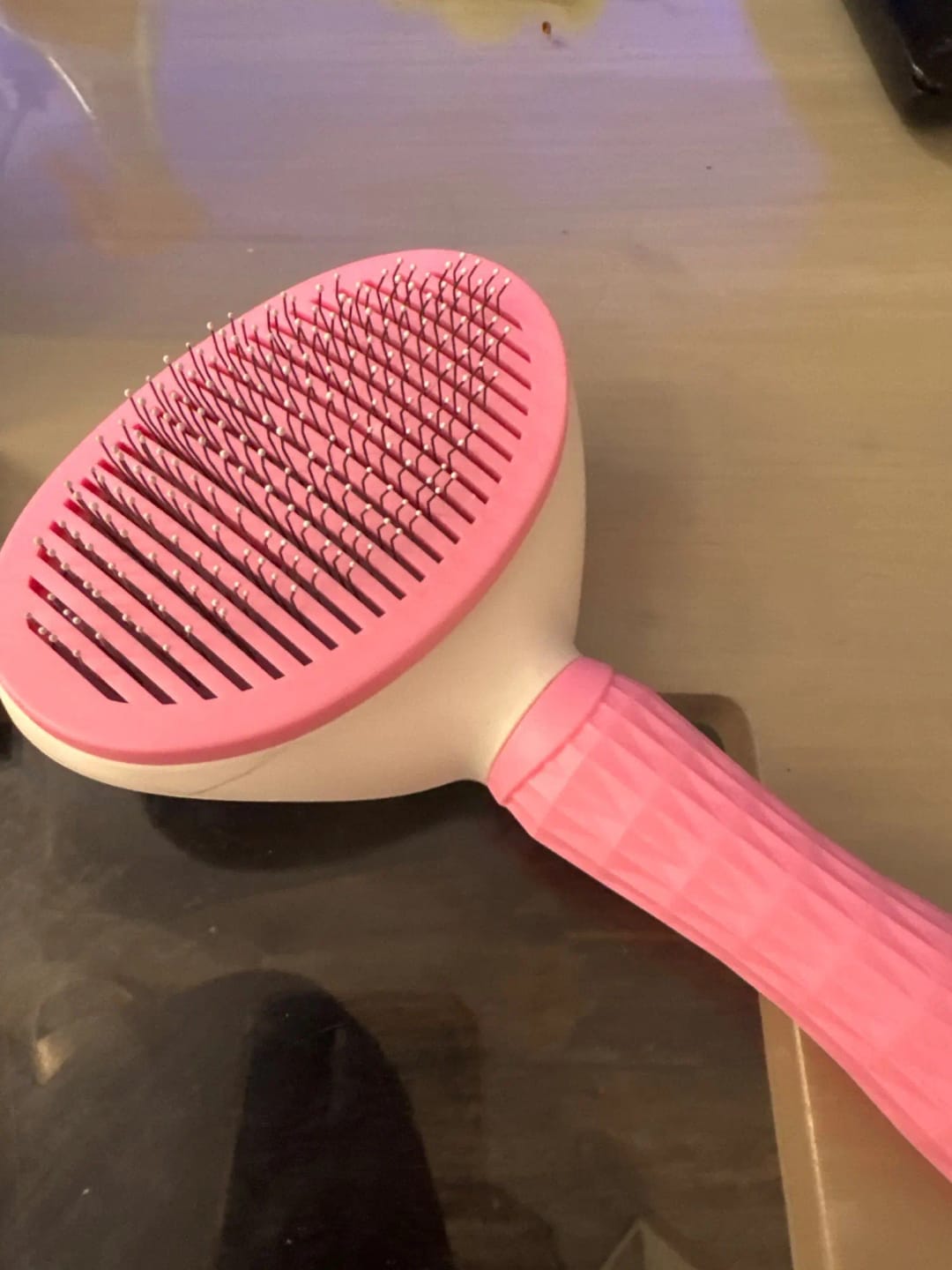 Customer photo review of Self Cleaning Pet Grooming Brush for Dogs and Cats