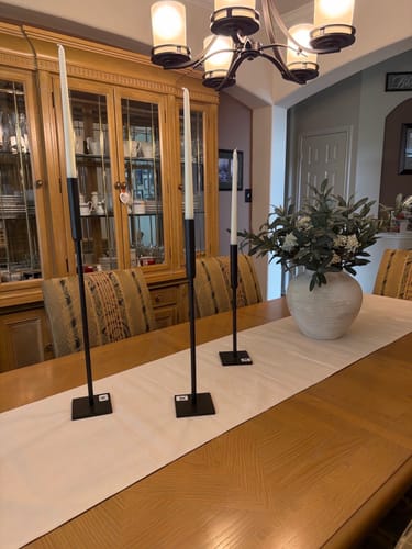 Reviewer's full Faux Olive & White Berry arrangement displayed in a white vase on a dining table.