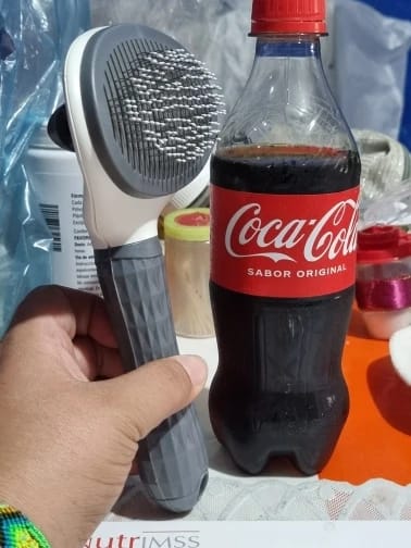 Customer photo review of Self Cleaning Pet Grooming Brush for Dogs and Cats