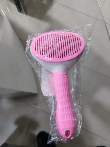 Customer photo review of Self Cleaning Pet Grooming Brush for Dogs and Cats