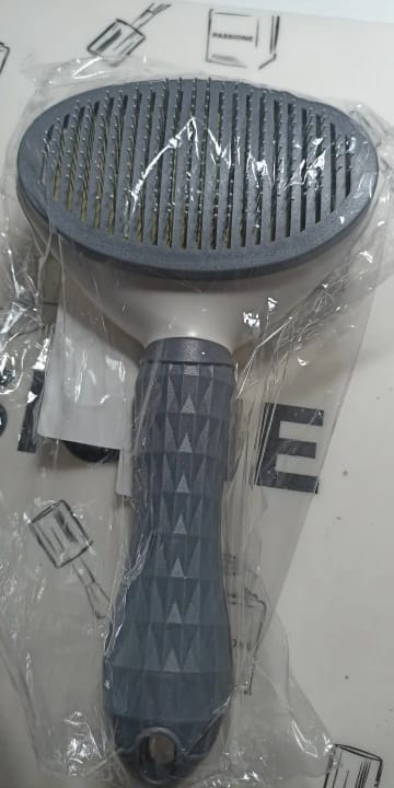 Customer photo review of Self Cleaning Pet Grooming Brush for Dogs and Cats