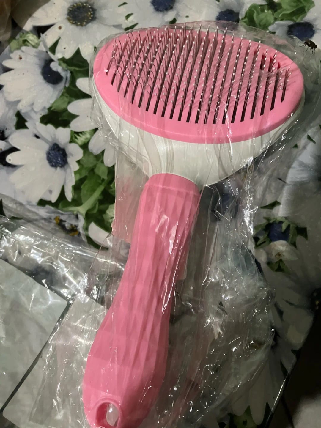 Customer photo review of Self Cleaning Pet Grooming Brush for Dogs and Cats