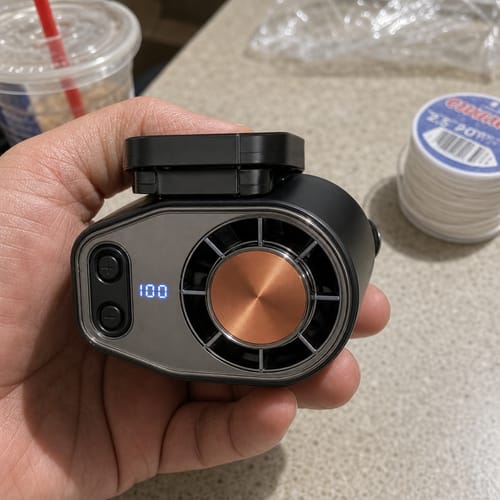 Customer holding the black cooling fan