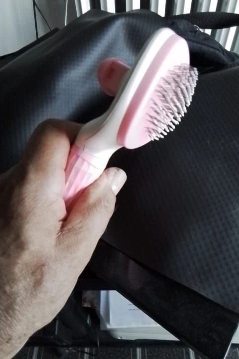 Customer photo review of Self Cleaning Pet Grooming Brush for Dogs and Cats