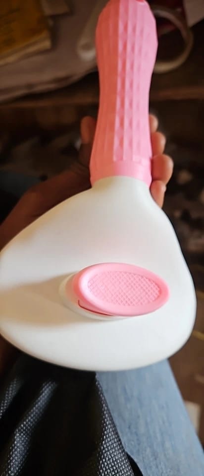 Customer photo review of Self Cleaning Pet Grooming Brush for Dogs and Cats