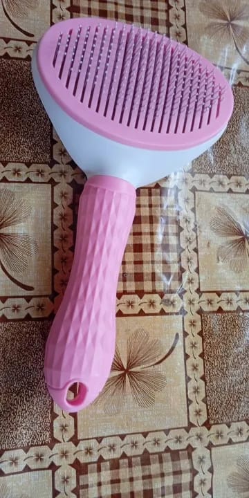 Customer photo review of Self Cleaning Pet Grooming Brush for Dogs and Cats