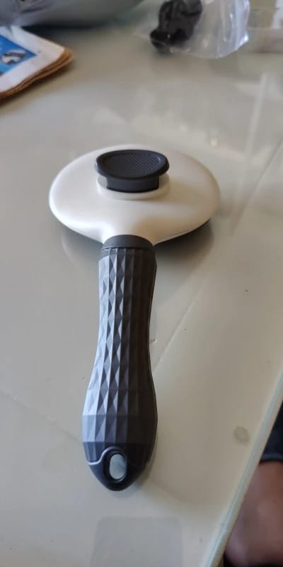 Customer photo review of Self Cleaning Pet Grooming Brush for Dogs and Cats