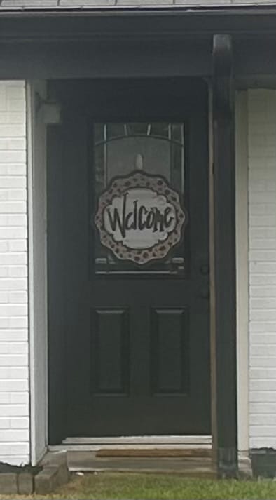 Customer photo review of Leopard Cheetah Welcome Door Hanger
