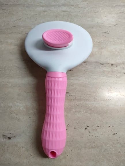 Customer photo review of Self Cleaning Pet Grooming Brush for Dogs and Cats