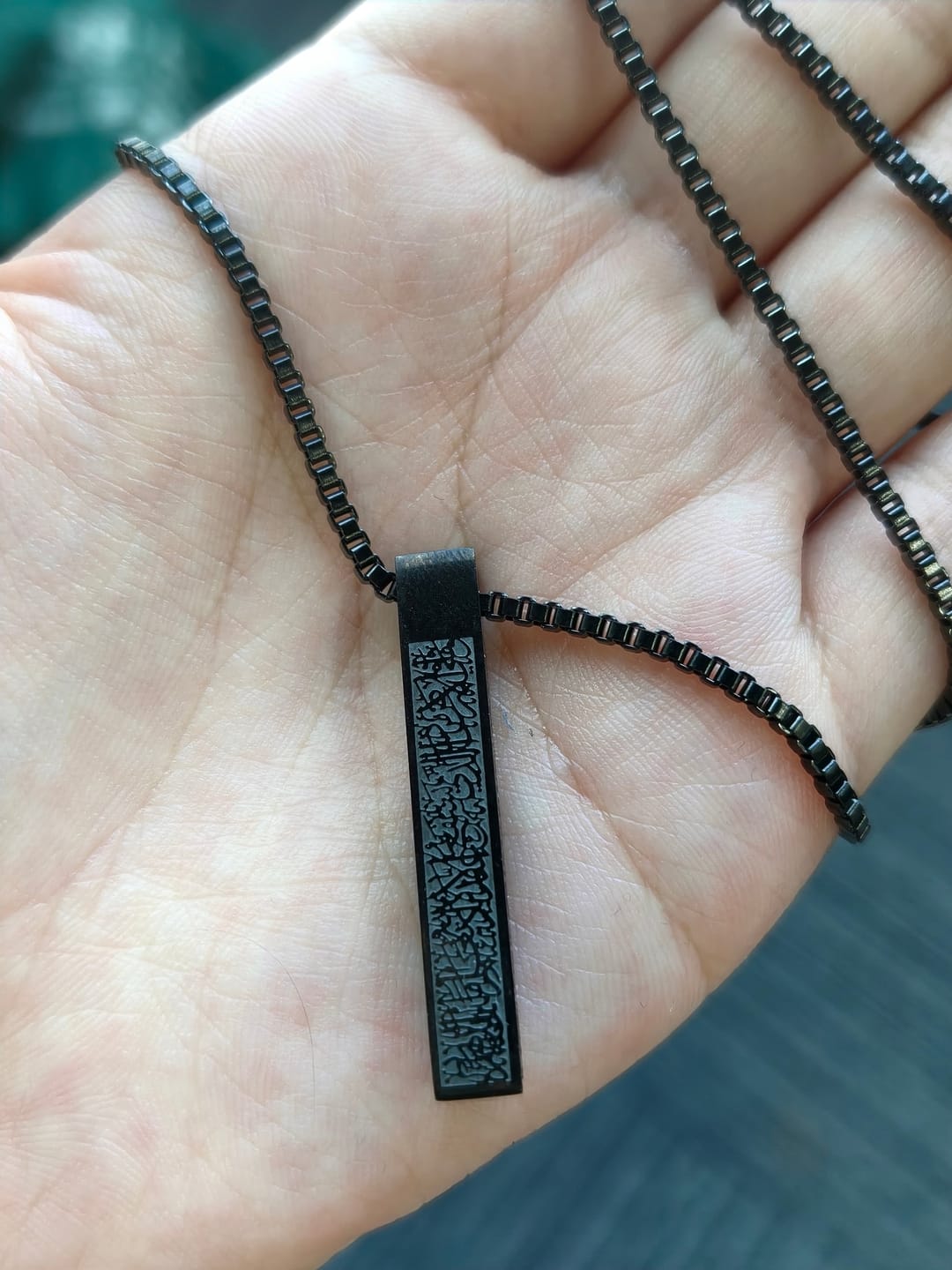 Customer photo review of HilalHaven Pillar of Protection Ayatul Kursi 4-Sided Bar Necklace — Polished Titanium Steel