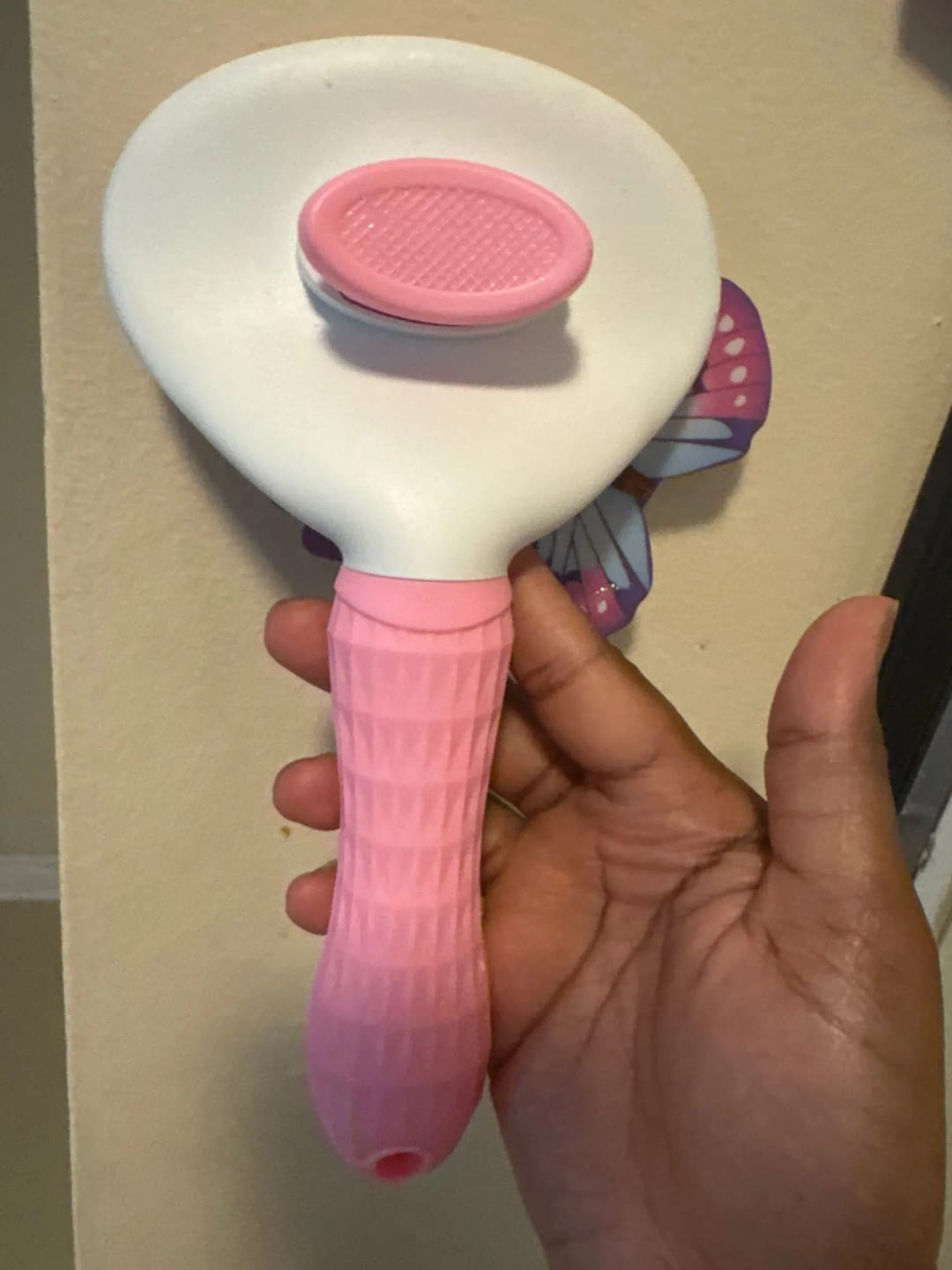 Customer photo review of Self Cleaning Pet Grooming Brush for Dogs and Cats