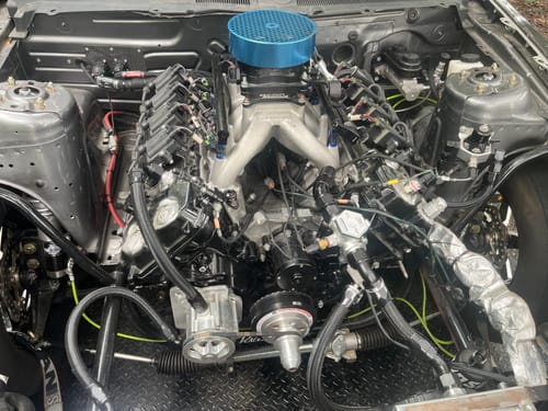 Customer's Billet Water Pump to AN Adaptor installed on a custom engine, showing its placement and fit.