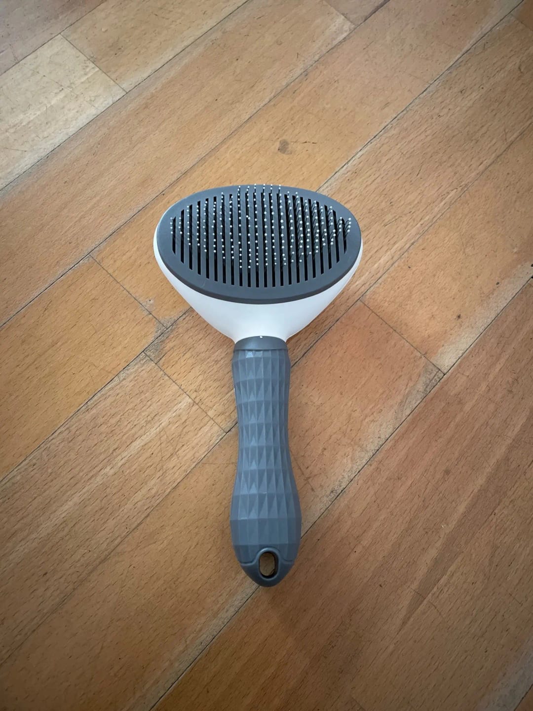 Customer photo review of Self Cleaning Pet Grooming Brush for Dogs and Cats