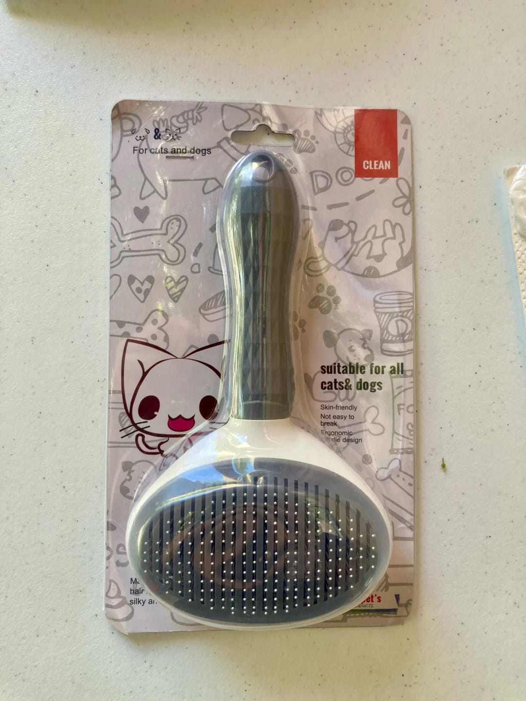 Customer photo review of Self Cleaning Pet Grooming Brush for Dogs and Cats